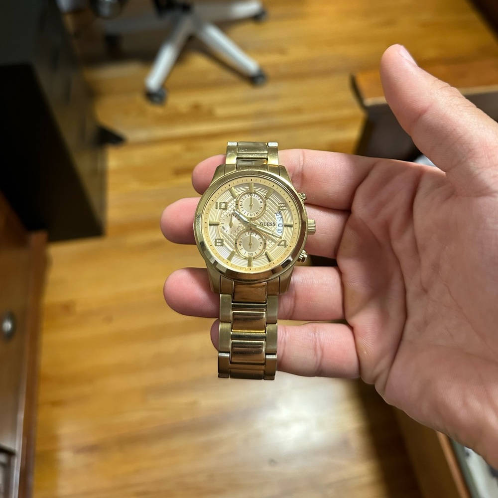Gold men’s Guess watch